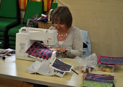 Jane H. working on fabric weaving