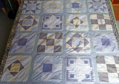 Christine L. completed quilt all made from shirts.