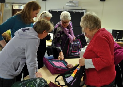 Group photo looking at Malin's bags