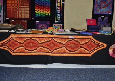 31. Sandy H. A table runner using a Bargello design